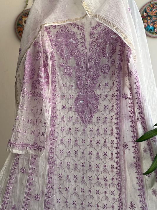 Elegant cream and lilac Chikankari Anarkali set styled for festive and summer occasions