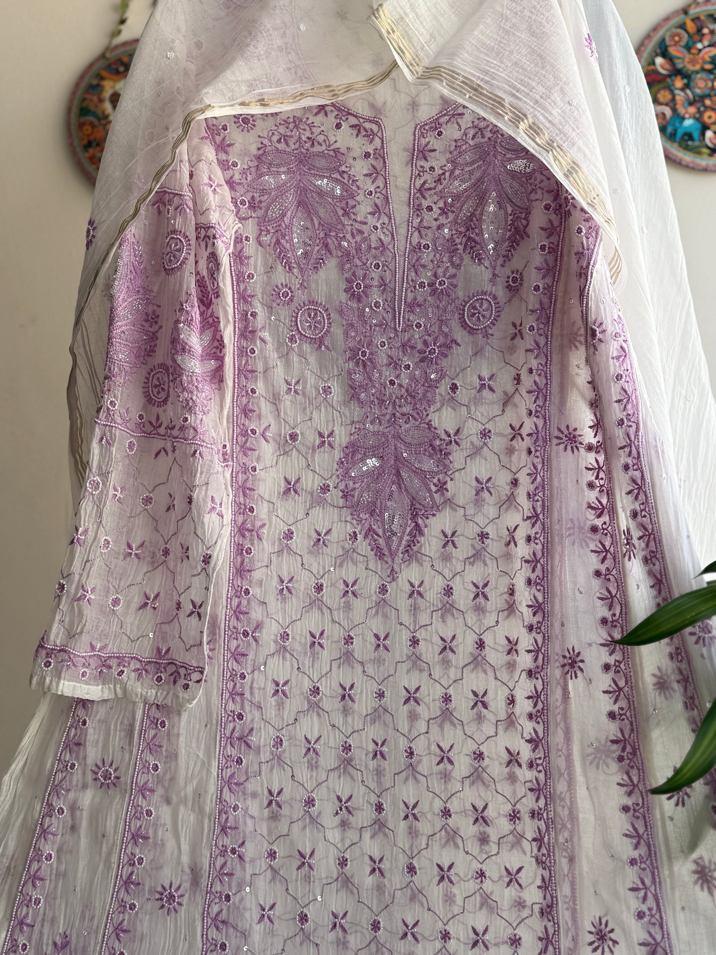 Elegant cream and lilac Chikankari Anarkali set styled for festive and summer occasions