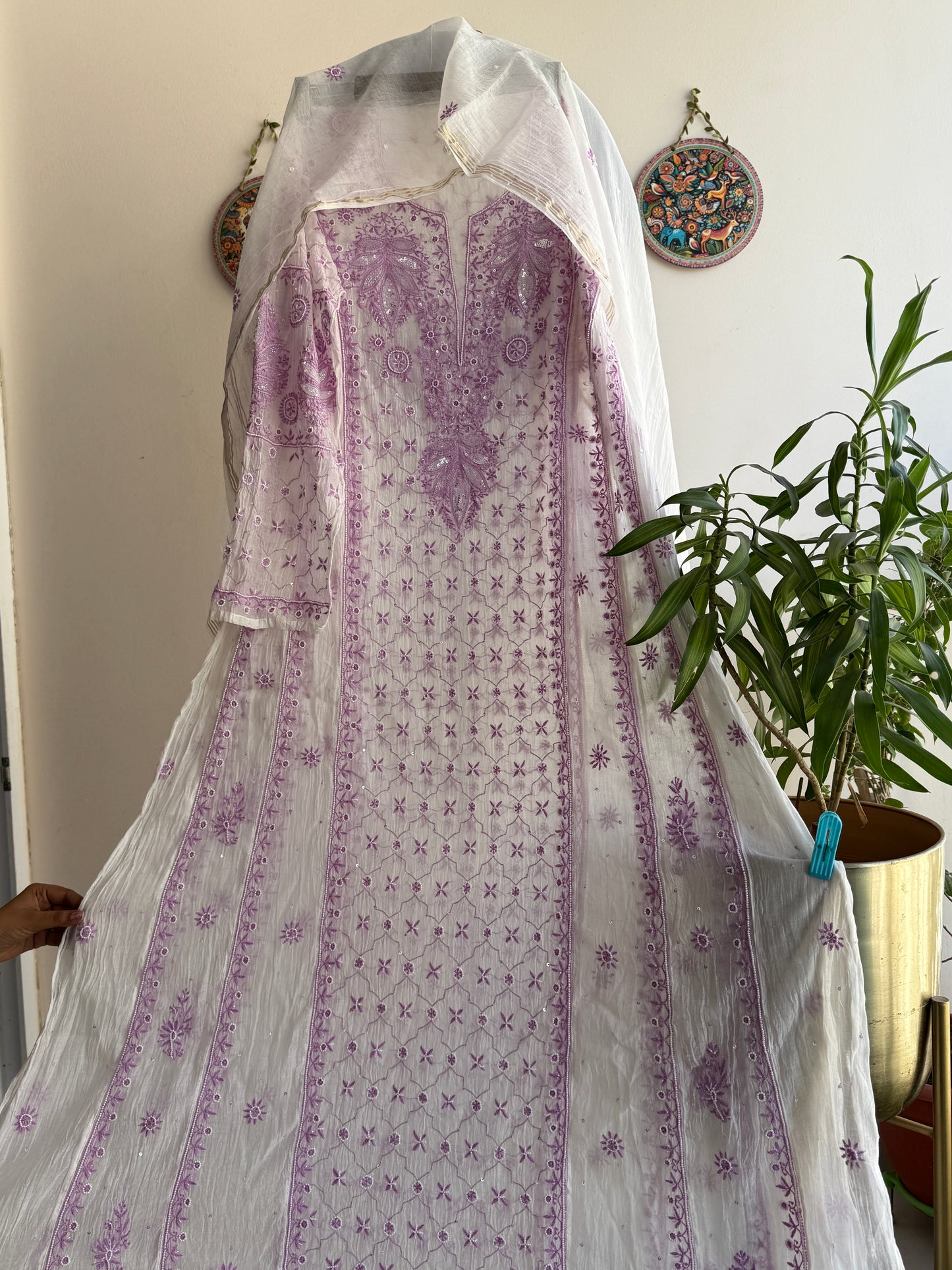 Elegant cream and lilac Chikankari Anarkali set styled for festive and summer occasions
