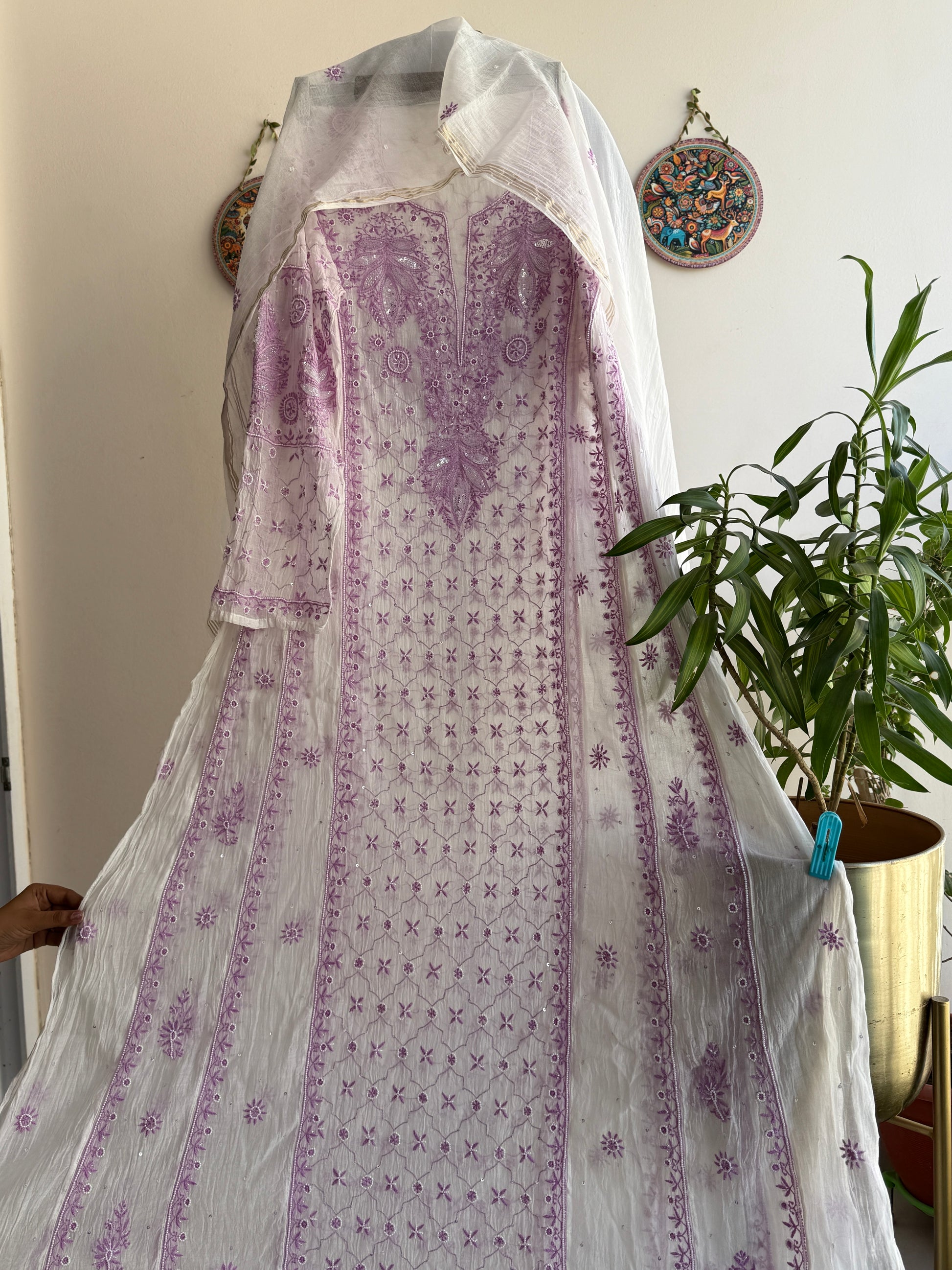 Elegant cream and lilac Chikankari Anarkali set styled for festive and summer occasions