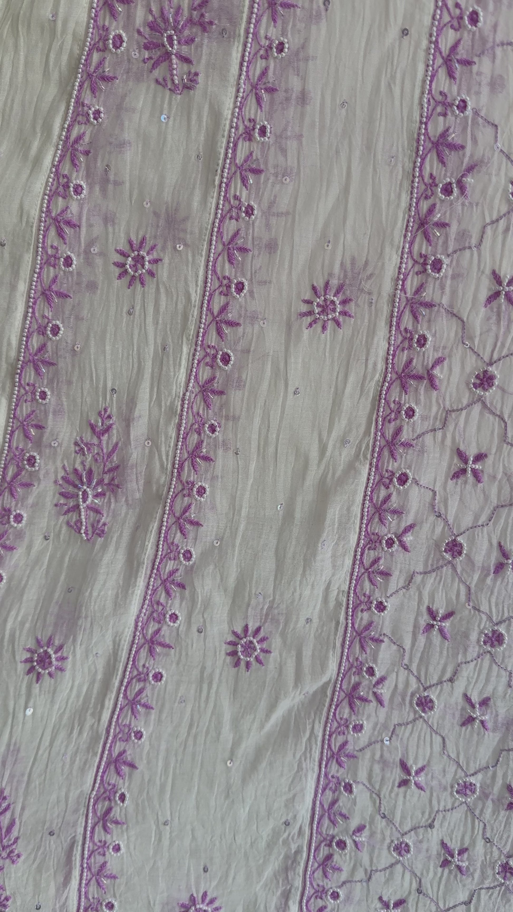 Elegant cream and lilac Chikankari Anarkali set styled for festive and summer occasions