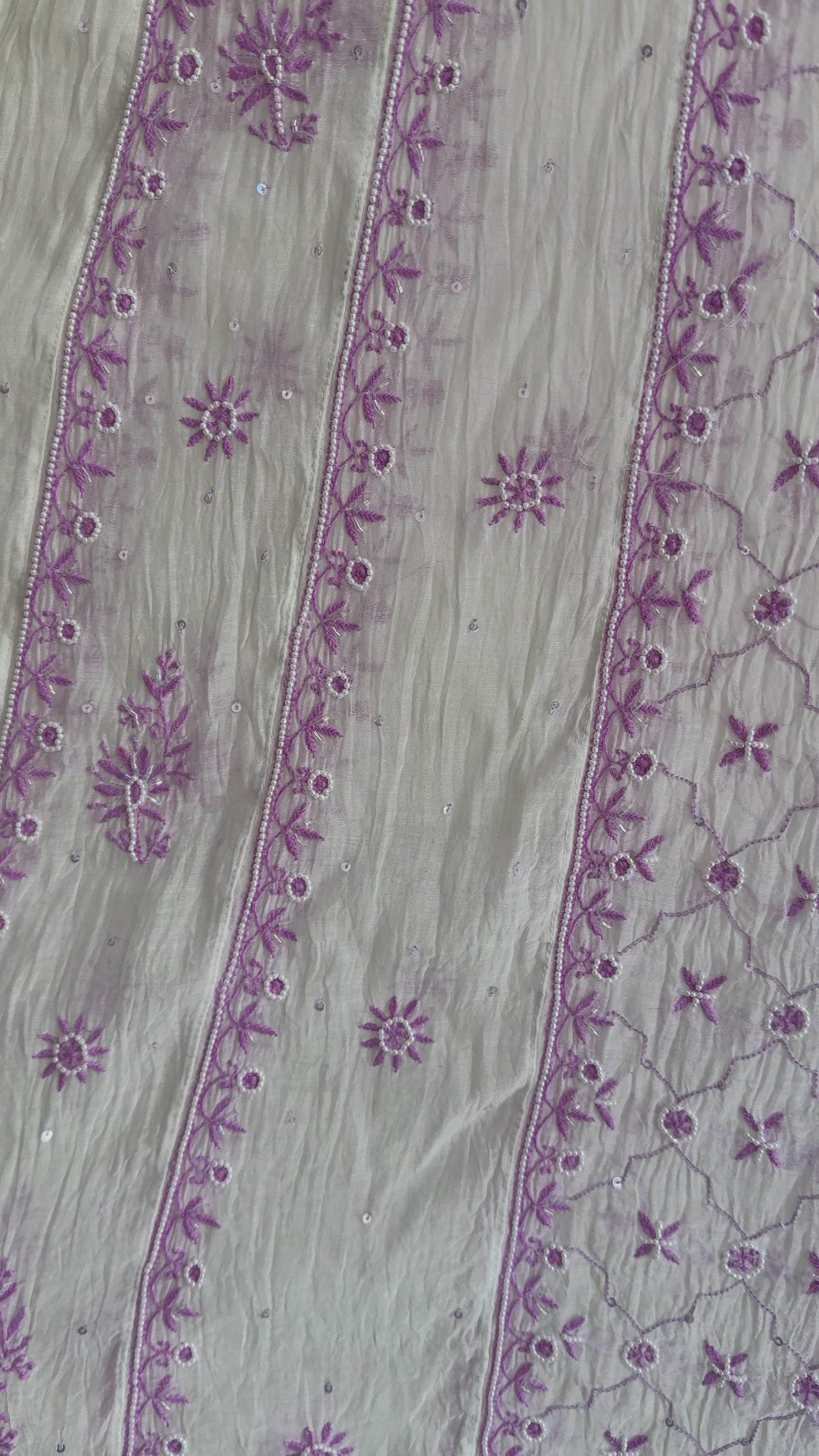 Elegant cream and lilac Chikankari Anarkali set styled for festive and summer occasions